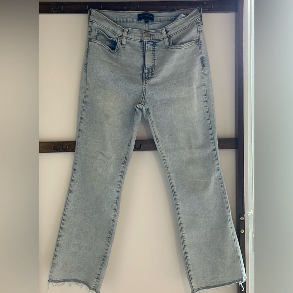 Banana Republic Demi boot cut in light wash with frayed bottom.